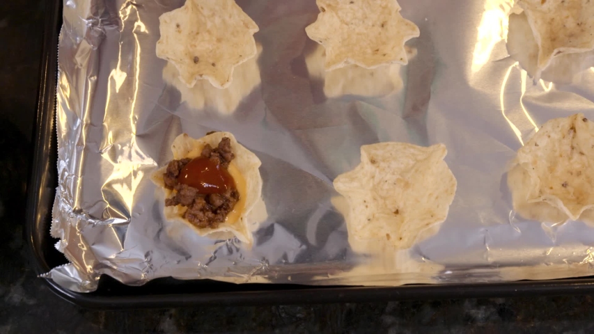 Top down close up of shredded cheese and tacos