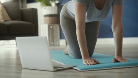 Static video of woman learning some yoga pose 