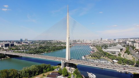 Aerial drone video of Ada bridge, a cable-stayed bridge over the Sava river in Belgrade, Serbia