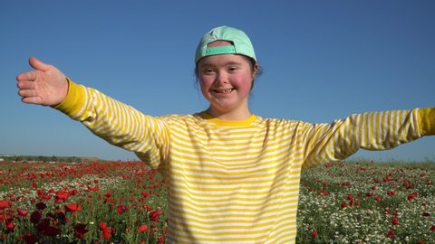 Girl on background of the flowers field