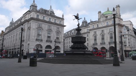 London. UK- 05.16.2020: Piccadilly Circus during corona virus lockdown. showing the Piccadilly Lights and Shaftesbury Memorial Fountain almost completely deserted.