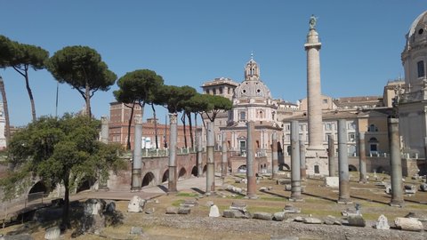 The Basilica Ulpia ruins and the Trajan's Column in Rome on a sunny day, Italy.