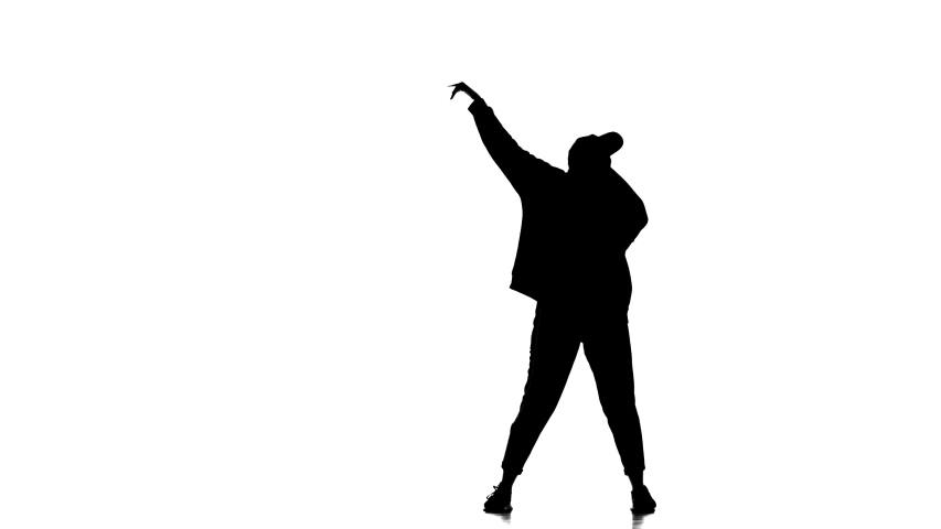 Black silhouette on a white background, young beautiful  woman dancer dancing hip hop, contemporary, modern street dance
