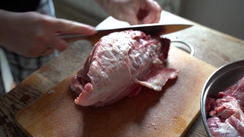 close up of cutting rabbit carcass at home