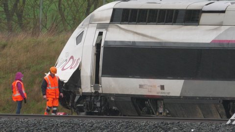 Ingenheim, France - Marc 5, 2020: Telephoto view of SNCF team working inspecting on the TGV train derailed near Ingenheim, Bas-Rhin, France on the LGV Est rail line due to a landslip
