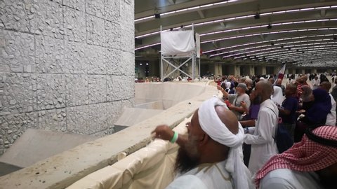 SAUDI ARABIA, Mecca, August 13, 2019 : Muslim pilgrims in 1440H performed a 'stoning of the devil' ritual at one of wall pillars (jamrah) in Mina. It is one of the rituals to complete the pilgrimage