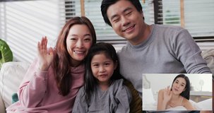 Asian Family Using Video Conference for video call  at home with happy emotion.