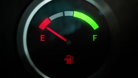 Analog Fuel Gauge Car Dashboard Pin Needle Fuel Full And Empty. Extreme Close Up Round Petrol Meter On Black Background. Red Light Turn Off When Tank is Full. Loop In 4K