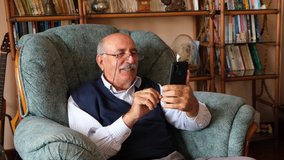 senior man using smart phone for communicate and make video chat with his children - Powered by Shutterstock - Get 15% off with code: PIKWIZARD15