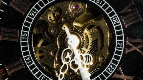 Antique pocket watch mechanism gears running in timelapse 4k extreme macro closeup
