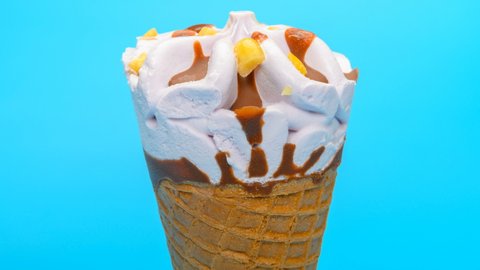 fresh sweet potato flavor ice cream cone melting timelapse on blue backgroud at 8K
