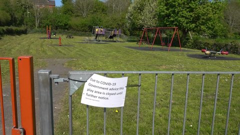 Warminster, Wiltshire  UK - April 24 2020: A childrens play area is temporarily closed due to Coronavirus Covid-19 sign                             