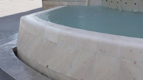 Water Overflow Over White Marble Fountain Decor