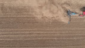 Video of the tractor in the field, shooting from the air.
