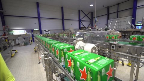 bruxeles / Belgium - 12 19 2019: Packs of beer in a industrial chain of production.