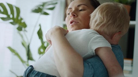 Video of mother embracing her anxious toddler. Shot with RED helium camera in 8K 