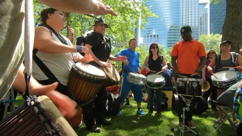 Montreal , Quebec / Canada - 07 01 2019: Percussion performers, musicians, band playing percussion, bongo, drum instruments, rhythm art, outside festival, tabla, beat drummers, tambourine, drums perfo