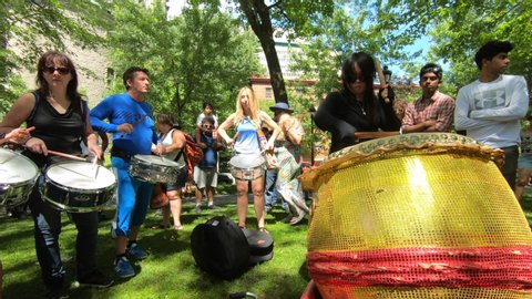 Montreal , Quebec / Canada - 07 01 2019: Percussion performers, musicians, band playing percussion, drum instruments, rhythm art, outside festival, tabla, beat drummers, tambourine, drums performance