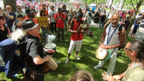 Montreal , Quebec / Canada - 07 01 2019: People watching a percussion outside show in park, Percussion performers, musicians, band playing percussion, drum instruments, rhythm art, festival, beat drum