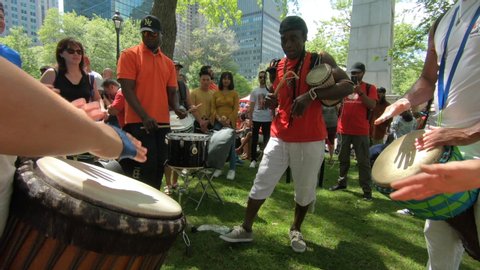 Montreal , Quebec / Canada - 07 01 2019: Percussion performers outside in park,, musicians, band playing percussion, drum instruments, rhythm art, outside festival, tabla, beat drummers, tambourine, d