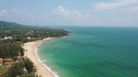 4K movie drone top view footage video shot of Southern island of thailand. Aerial shot of beach deep blue sea water and foamy waves.