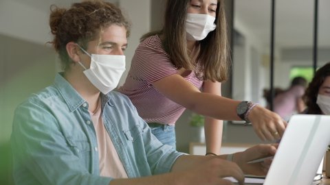 group of students working wearing masks