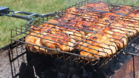 Barbecue chicken is cooked on the grill