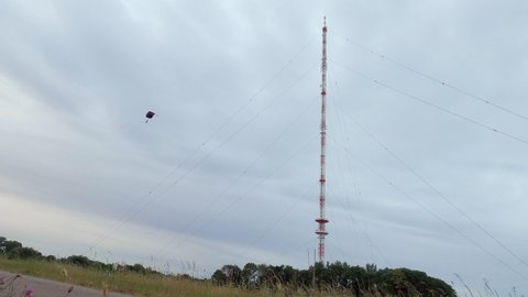 Man BASE jumping from antenna