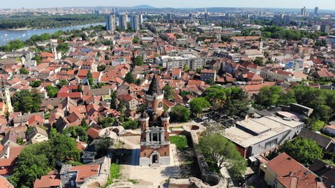 Aerial drone video of Gardos tower in Zemun, an old municipality of Belgrade, Serbia. City skyline.