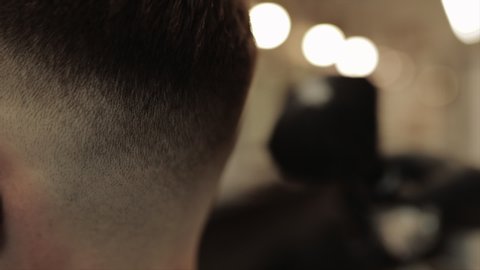 Men's hair. Barber tools close-up. The beginning of the haircut. Slow motion video.