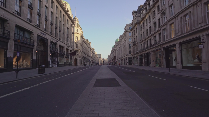 London / UK - 05/23/2020: London's busy area, popular destination empty as people self isolate during COVID-19 coronavirus pandemic. Nobody at Regent street road | Shutterstock HD Video #1053225323