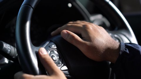 Close up male hand honking the car horn because of traffic jam. 4K resolution.