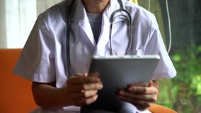 Hand doctor using digital tablet for online treatment.  Telemedicine concept