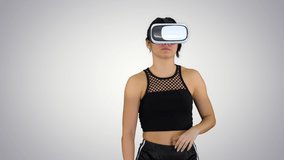 Girl playing virtual reality dancing game Experienced dancer on gradient background.