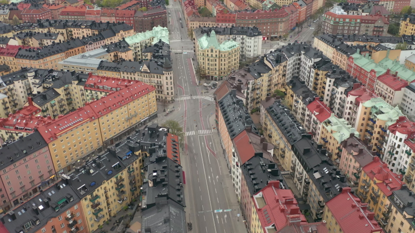 Empty Stockholm city during Covid-19 Coronavirus pandemic outbreak. Aerial view of rooftops, buildings & avenues.