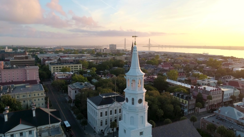 Charleston Church Steeples and Bridge lined up at sunrise. Iconic historic Charleston, South Carolina aerial view.