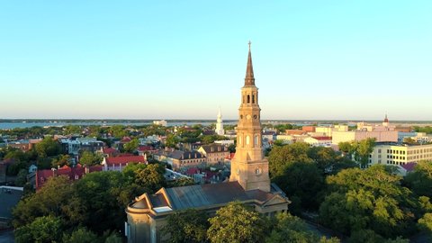 Charleston, SC skyline with Church steeples and harbor water, filmed with drone.
