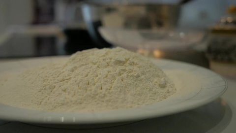 Flour on a plate, slow rotation. Milk Powder (semaless loopable 4K footage)