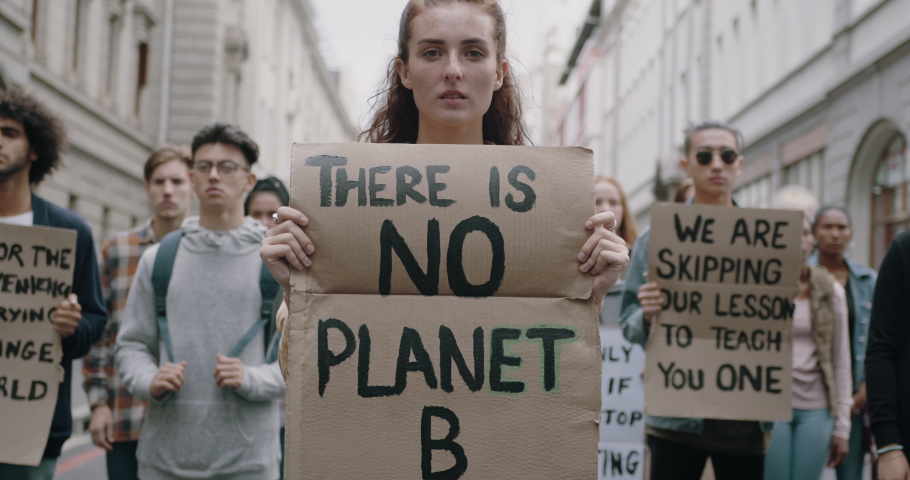 Activists silently protesting against global warming.  Group of protestors standing on the street with posters. Nonviolent demonstration. 
 Royalty-Free Stock Footage #1053265037