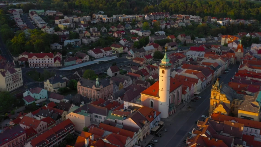 Aerial view to historic center of Domazlice city in sunset. Medieval town was first recorded as a town in 1231. Beautiful destination in Western Bohemia. Czech Republic, Central Europe.