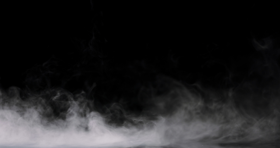 Swirling smoke rolling low across the ground. | Shutterstock HD Video #1053278369