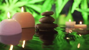Spa Still Life, Stones massage and Water Relax. Close up. Relaxing view of burning candles. water reflection on blurred background.   Relaxation, meditation, peace and quiet. - Powered by Shutterstock - Get 15% off with code: PIKWIZARD15