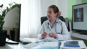 medical officer works online communicates using web camera on computer using modern technologies as patient advised treatment of disease or cold