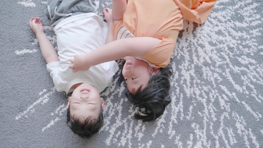 Asian family playing indoors on weekends