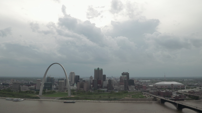 Mississippi river and St. Louis arch in stormy weather. Aerial dolly left