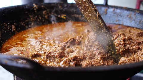 Close up of Rendang Daging or Beef Stew in the wok.A popular dishes among muslim during Hari Raya Festival. 