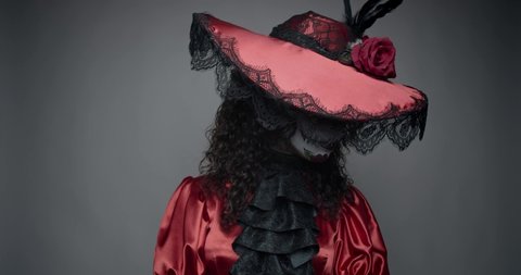 Creepy woman with a colorful skull face paint, wearing red dress and a hat, 4k