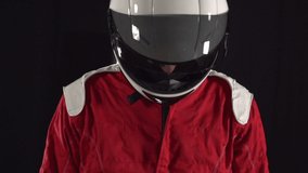 Motor Racing Driver with Helmet slowly looking up. Grand Prix man. Motorsports. Super slow motion. - Stock Video Clip Footage