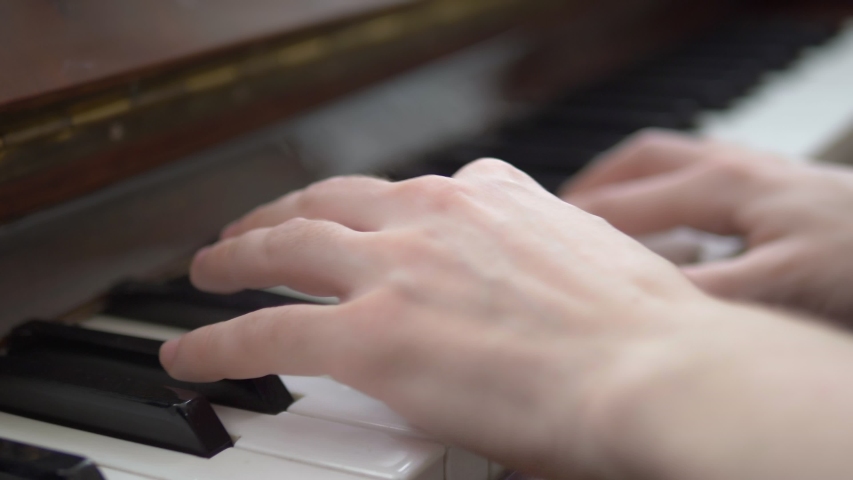 closeup. female hands masterfully play the arpeggio on the piano. Royalty-Free Stock Footage #1053319079