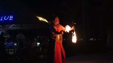 Professional artists staged a nightly show on the sandy beach, entertaining visitors to cafes and restaurants by the sea waving fireballs in Nha Trang, Vietnam, May 8, 2020.